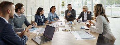 Office workers working together in a conference room