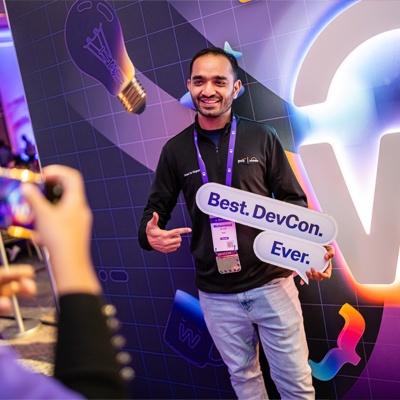 man holding sign at DevCon