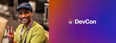 man at Workday DevCon giving peace sign