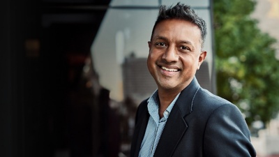 man standing outside smiling at camera