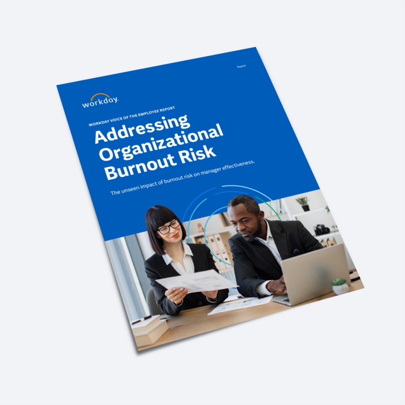 鶹ý report titled "Addressing Organizational Burnout Risk," featuring a photo of two coworkers reviewing a paper.