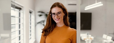 A woman standing in an office.