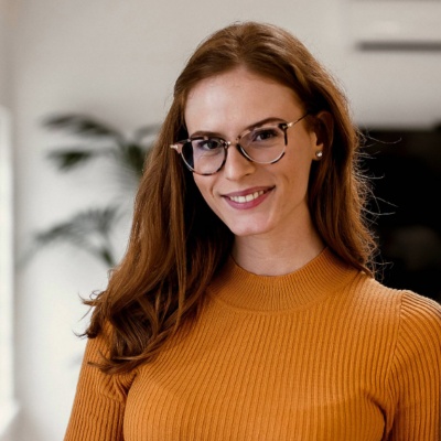 A woman standing in an office.