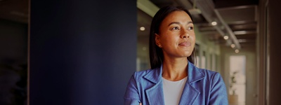 A photo of an Australian CFO looking out an office window.