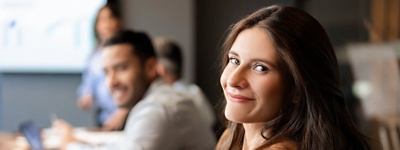 Australian public servants sitting at a conference table in an office.