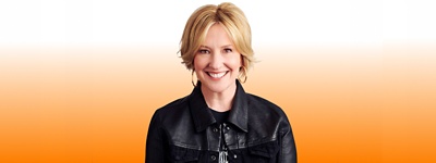 Brené Brown in front of gradient background