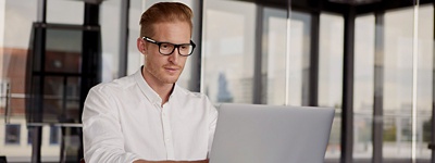 Businessman looking at laptop at desk