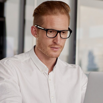 Businessman looking at laptop at desk