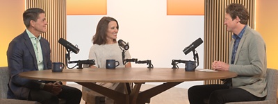 Carl ashley chris at table with microphones