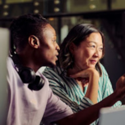 Two colleagues looking at computer screen