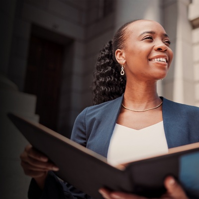 Smiling businesswoman holding a tablet