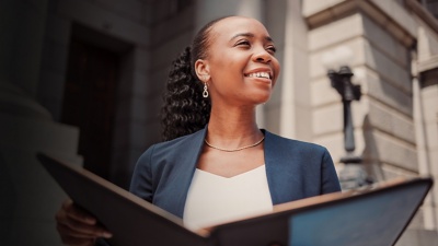 Smiling businesswoman holding a tablet