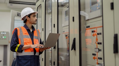 Image of worker looking at a server