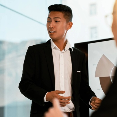 Shot of a young businessman giving a presentation to his colleagues in an office