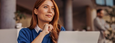 Woman sitting in front of laptop