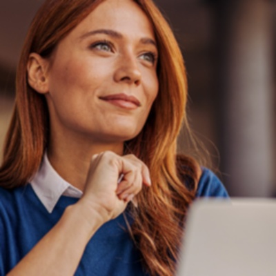 Woman sitting in front of laptop