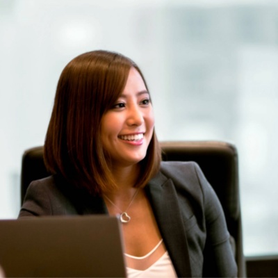 Financial services professionals sitting around an office desk.