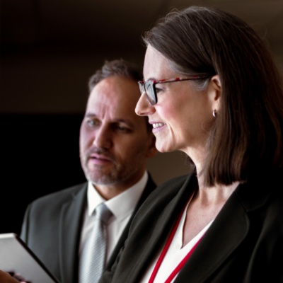 Two colleagues working on laptop together