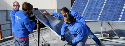 Workers installing solar panels