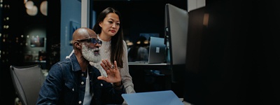 colleagues working on a computer