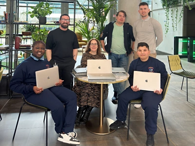 People sitting and standing around table 