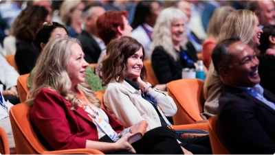 Executive Symposium attendees sitting in the auditorium.
