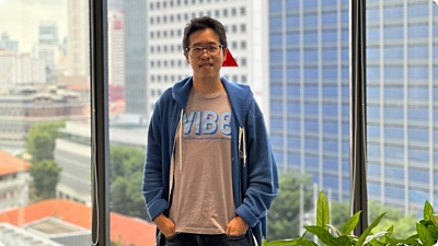 A workmate standing by a window.