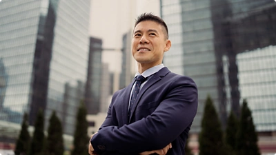 man smiling in a city