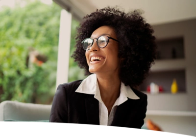 woman with glasses smiling