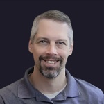 headshot of John Adkins