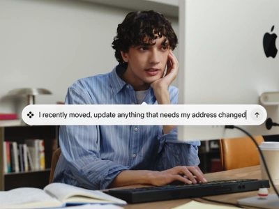 A professional using the Workday Sana AI interface on a laptop at a desk.