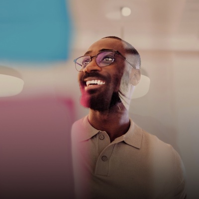 Business person casually dressed and smiling in an office setting