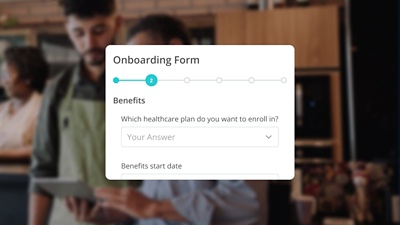 Close-up view of a digital Onboarding Form showing the 'Benefits' section, asking 'Which healthcare plan do you want to enroll in?' against a blurred background of retail employees. The form displays a progress bar (step 2), illustrating the platform's ability to instantly deliver onboarding forms and handbooks, such as benefit enrollment and Form I-9, using pre-built templates.