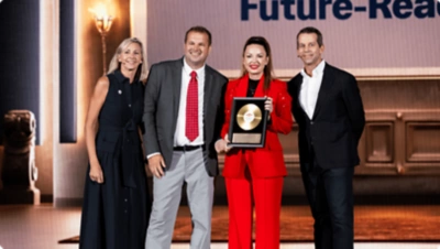 DevCon attendees on stage presenting an award.