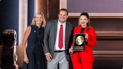 Four people sitting at a table talking.