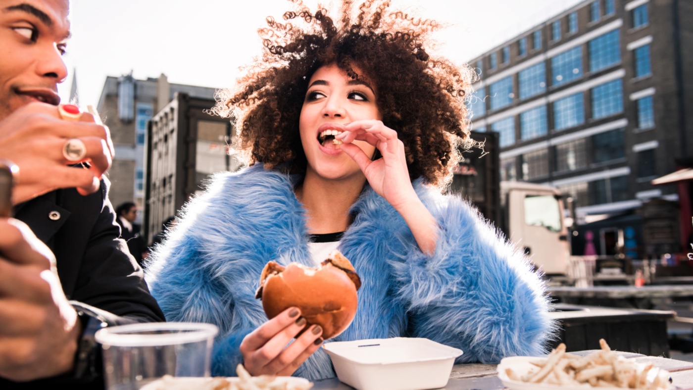Woman Eating Burger 16x9