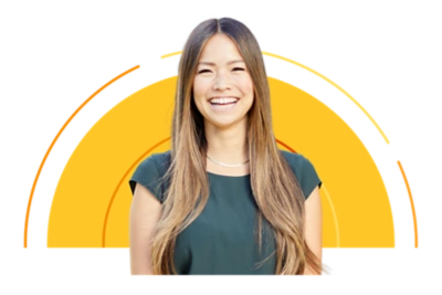 Woman smiling against a yellow sun shape