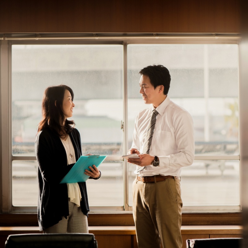 Two businesspeople talking together