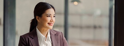 A CHRO looking out the window of their office in Japan.