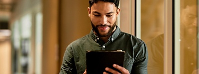 Man looking at tablet