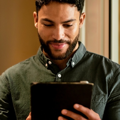 Man looking at tablet