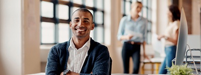 Man smiling looking into camera head on