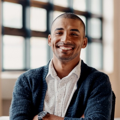 Man smiling looking into camera head on