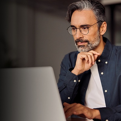 Man looking at laptop computer screen