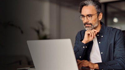 Man looking at laptop computer screen