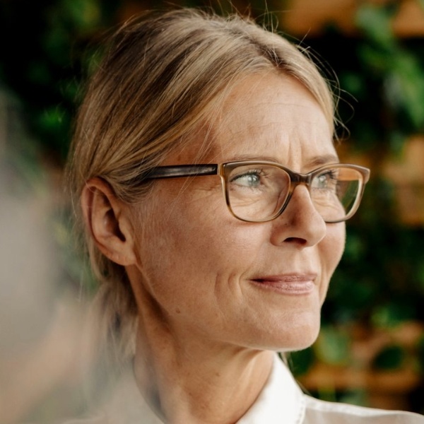 A photo of an HR leader looking out the window.