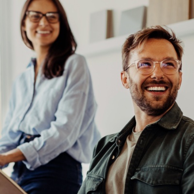 People in office looking and smiling