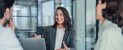 Group of happy colleagues in an office conference room