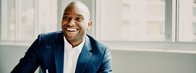 Smiling businessman in discussion at work