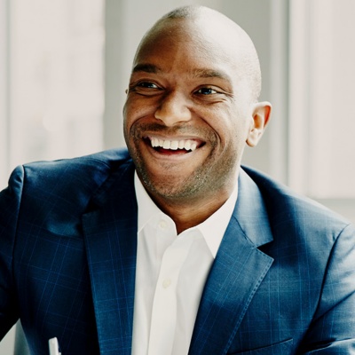 Smiling businessman in discussion at work
